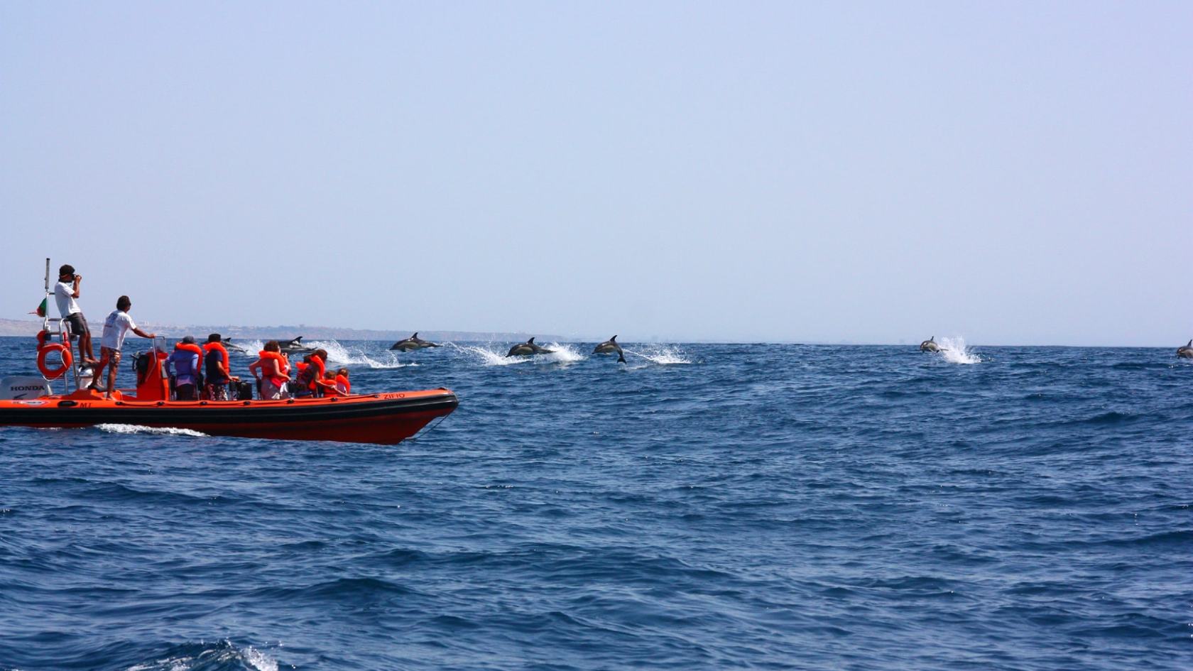 a small boat in a large body of water