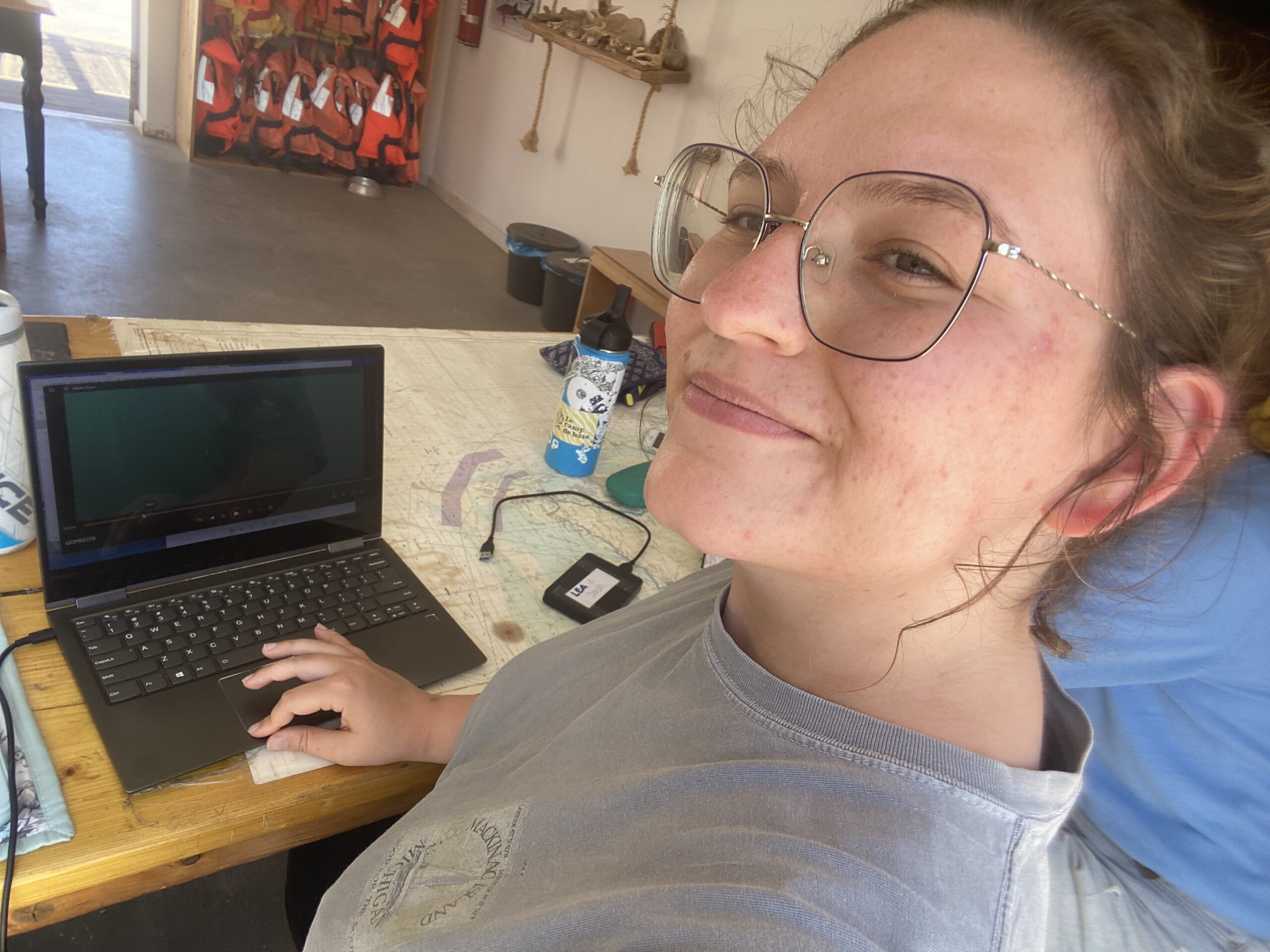 a woman working on a laptop computer